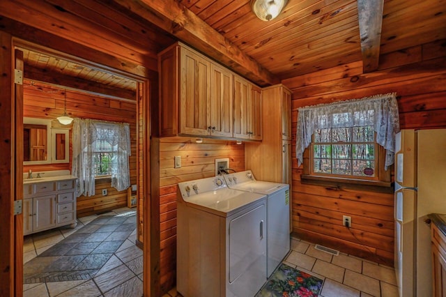 14 E Point Rd, Albrightsville, PA 18210 - washroom with separate washer and dryer, wooden ceiling, cabinet space, wooden walls, and tile patterned floors