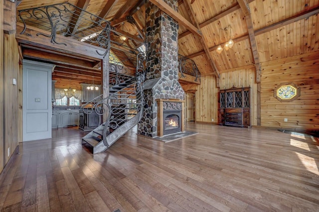 14 E Point Rd, Albrightsville, PA 18210 - unfurnished living room with wood-type flooring, wood ceiling, wooden walls, beamed ceiling, and high vaulted ceiling