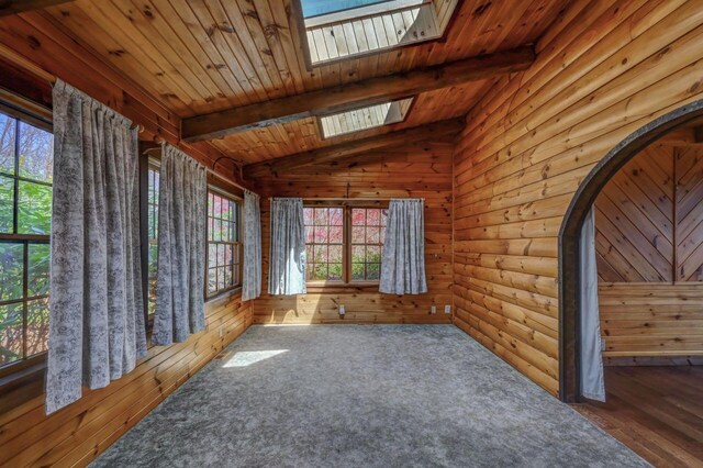 14 E Point Rd, Albrightsville, PA 18210 - empty room featuring a skylight, arched walkways, and wooden ceiling