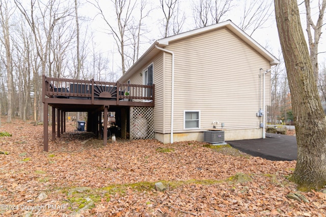 133 Sundew Dr, East Stroudsburg, PA 18301 - view of home's exterior featuring a wooden deck and a cooling unit