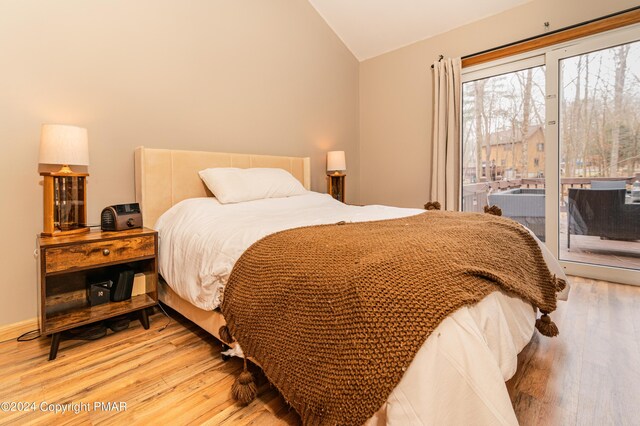 133 Sundew Dr, East Stroudsburg, PA 18301 - bedroom featuring vaulted ceiling, light wood-style floors, and access to outside