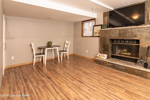 133 Sundew Dr, East Stroudsburg, PA 18301 - dining area with wood finished floors and a stone fireplace