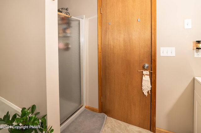 133 Sundew Dr, East Stroudsburg, PA 18301 - full bathroom featuring a stall shower, vanity, and tile patterned flooring