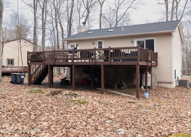 133 Sundew Dr, East Stroudsburg, PA 18301 - rear view of house with a deck, a chimney, stairway, and a shingled roof