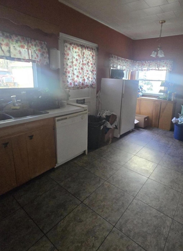 207 Broad Ave, Susquehanna, PA 18847 - kitchen with white appliances, tile patterned floors, light countertops, and hanging light fixtures