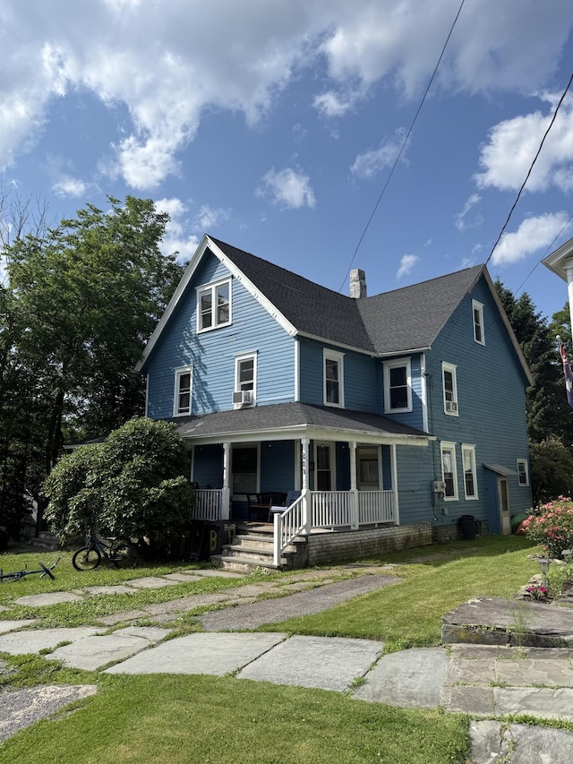 207 Broad Ave, Susquehanna, PA 18847 - view of front of home with a porch, a chimney, a front lawn, and roof with shingles