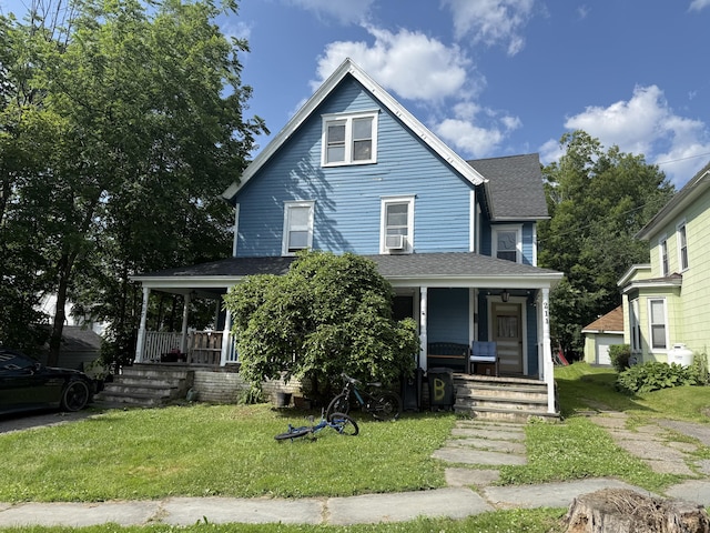 207 Broad Ave, Susquehanna, PA 18847 - view of front of home featuring covered porch, roof with shingles, and a front yard