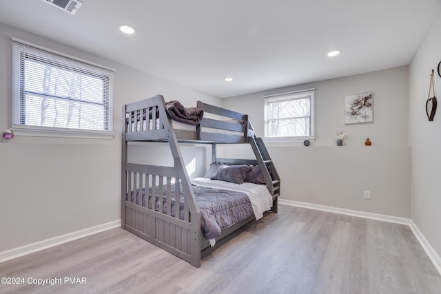 bedroom featuring recessed lighting, baseboards, and wood finished floors