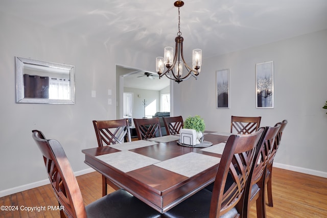 dining room with light wood-style floors and baseboards