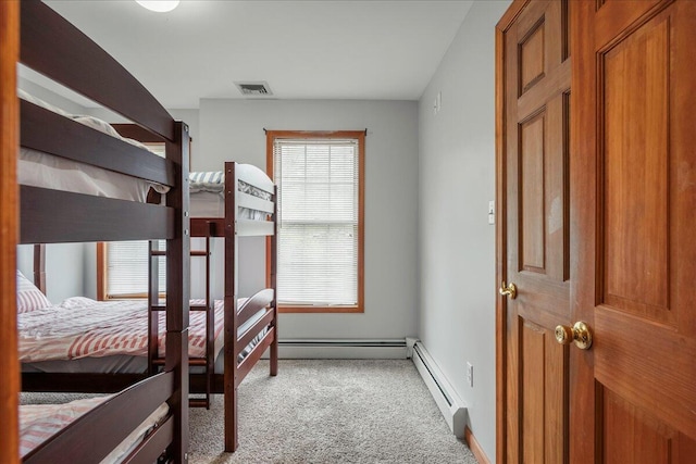 392 Hemlock Dr, Tobyhanna, PA 18466 - carpeted bedroom with baseboard heating and baseboards