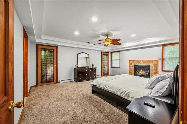 392 Hemlock Dr, Tobyhanna, PA 18466 - carpeted bedroom featuring a baseboard heating unit, a raised ceiling, recessed lighting, multiple windows, and baseboards