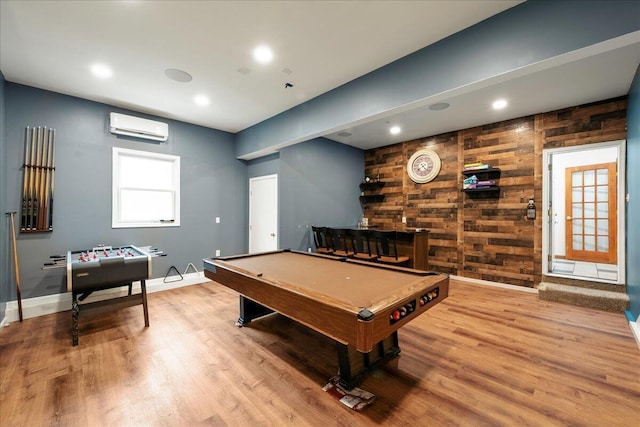 392 Hemlock Dr, Tobyhanna, PA 18466 - rec room featuring a wall mounted air conditioner, wood finished floors, pool table, wooden walls, and baseboards