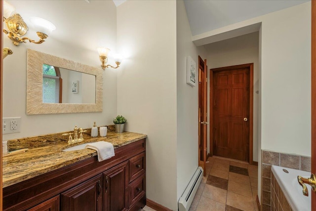 392 Hemlock Dr, Tobyhanna, PA 18466 - full bathroom featuring a baseboard heating unit, vanity, tiled bath, and tile patterned flooring