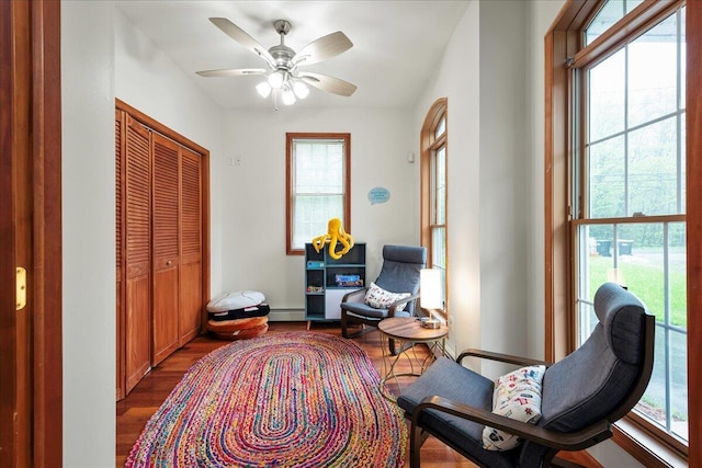 392 Hemlock Dr, Tobyhanna, PA 18466 - sitting room featuring wood finished floors, a baseboard radiator, and ceiling fan