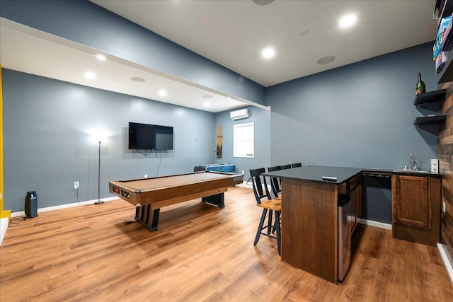 392 Hemlock Dr, Tobyhanna, PA 18466 - playroom featuring wood finished floors, billiards table, a wall unit AC, bar with sink, and baseboards