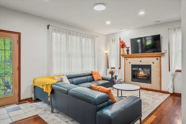 392 Hemlock Dr, Tobyhanna, PA 18466 - living area featuring hardwood / wood-style floors, a tiled fireplace, baseboards, and recessed lighting