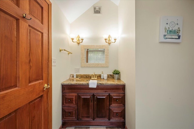 392 Hemlock Dr, Tobyhanna, PA 18466 - bathroom with vanity and vaulted ceiling