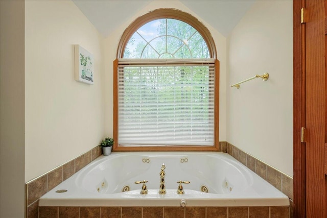392 Hemlock Dr, Tobyhanna, PA 18466 - full bathroom featuring vaulted ceiling and a whirlpool tub