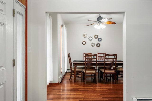 392 Hemlock Dr, Tobyhanna, PA 18466 - dining space featuring ceiling fan, wood finished floors, and a baseboard heating unit