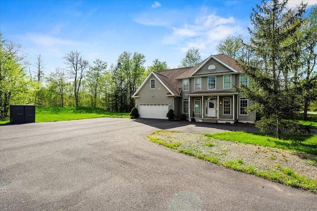 392 Hemlock Dr, Tobyhanna, PA 18466 - view of front of property featuring a porch, asphalt driveway, and a front lawn