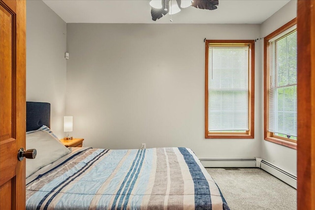 392 Hemlock Dr, Tobyhanna, PA 18466 - bedroom featuring carpet flooring, a baseboard radiator, and a ceiling fan
