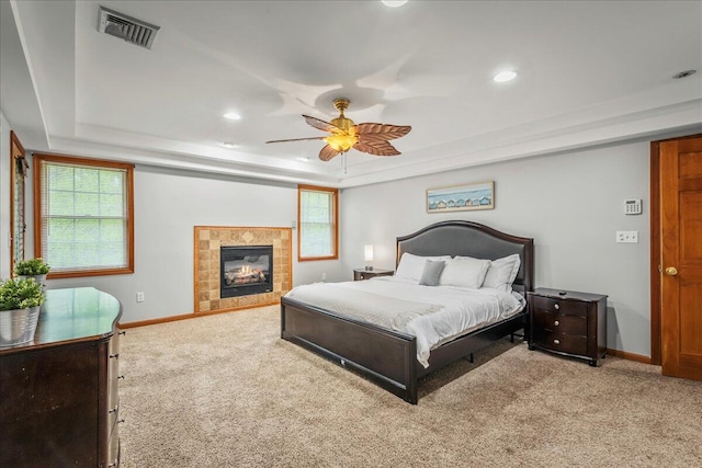 392 Hemlock Dr, Tobyhanna, PA 18466 - carpeted bedroom with a raised ceiling, baseboards, recessed lighting, a tile fireplace, and ceiling fan