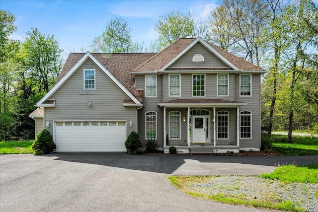 392 Hemlock Dr, Tobyhanna, PA 18466 - view of front of property with driveway, a porch, and a garage