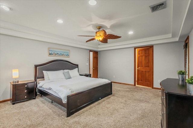 392 Hemlock Dr, Tobyhanna, PA 18466 - bedroom with a tray ceiling, light carpet, baseboards, recessed lighting, and a ceiling fan