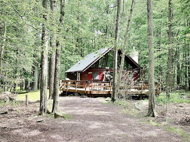 256 Partridge Dr, Pocono Lake, PA 18347 - rustic home featuring a deck, a chimney, and a forest view