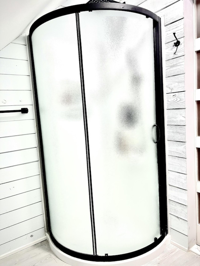 256 Partridge Dr, Pocono Lake, PA 18347 - bathroom with a stall shower, baseboards, and wood finished floors