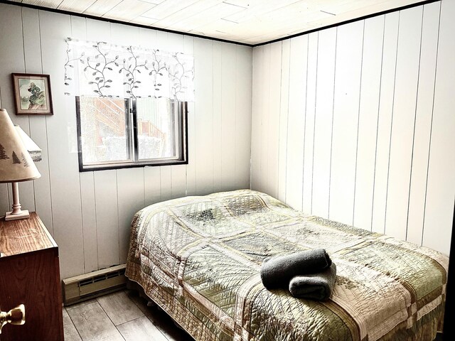 256 Partridge Dr, Pocono Lake, PA 18347 - bedroom with a baseboard radiator and light wood finished floors