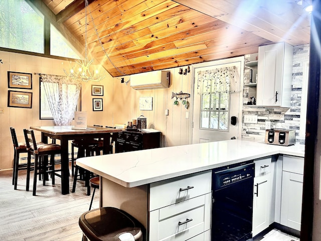 256 Partridge Dr, Pocono Lake, PA 18347 - kitchen with an AC wall unit, black dishwasher, wood ceiling, open shelves, and a peninsula