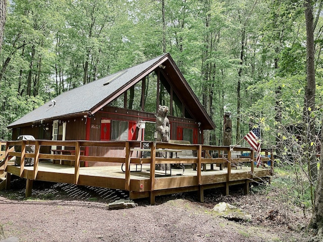 256 Partridge Dr, Pocono Lake, PA 18347 - rear view of house with a forest view and a deck