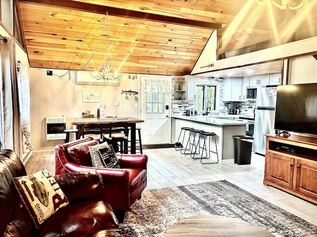 256 Partridge Dr, Pocono Lake, PA 18347 - living area with heating unit, wooden ceiling, a chandelier, light wood-style floors, and vaulted ceiling