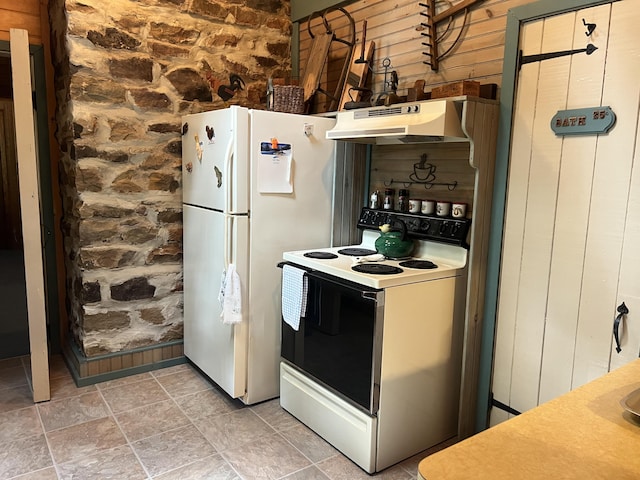 40 Crest Dr, Lake Harmony, PA 18624 - kitchen with white appliances, under cabinet range hood, light stone finish flooring, and wooden walls