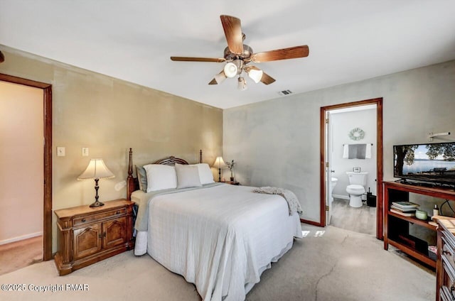 bedroom with connected bathroom and ceiling fan