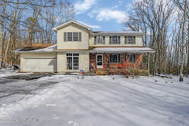 view of front of property featuring a porch and a garage