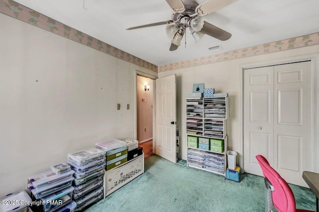 interior space with ceiling fan