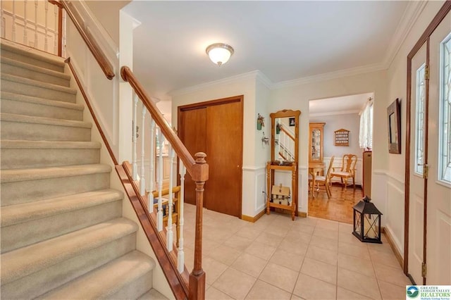 536 Mcilhaney Rd, Stroudsburg, PA 18360 - foyer with stairway, crown molding, a wainscoted wall, and light tile patterned floors