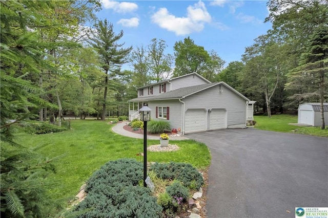 536 Mcilhaney Rd, Stroudsburg, PA 18360 - traditional-style home featuring an attached garage, a front lawn, driveway, and a storage shed
