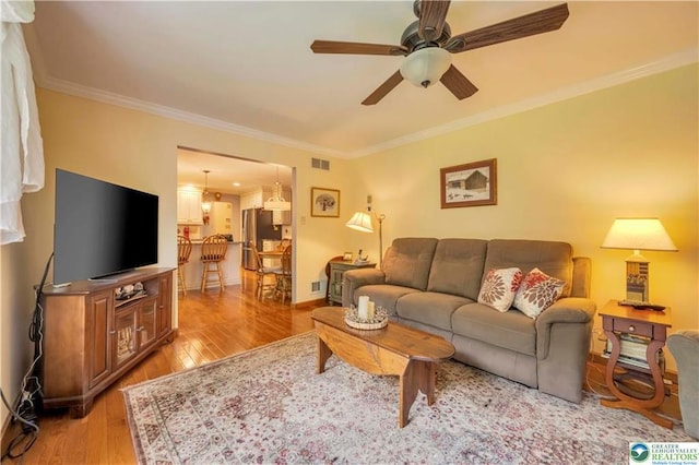 536 Mcilhaney Rd, Stroudsburg, PA 18360 - living area with crown molding, light wood-type flooring, and ceiling fan