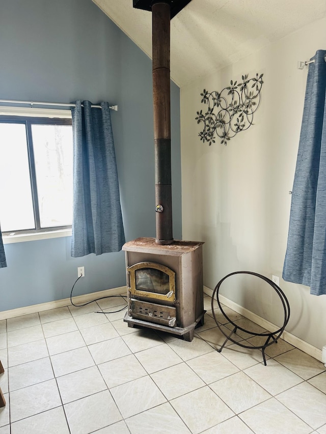 room details with baseboards and a wood stove