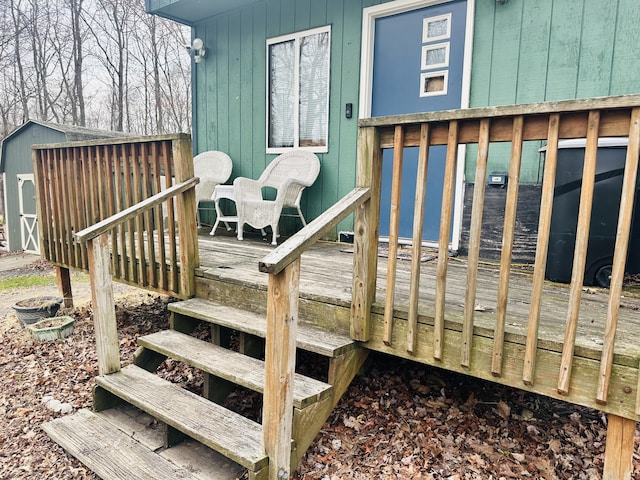 deck with an outdoor structure and a shed