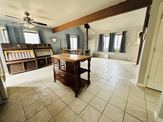 dining room featuring ceiling fan, a wood stove, light tile patterned floors, a baseboard radiator, and beamed ceiling