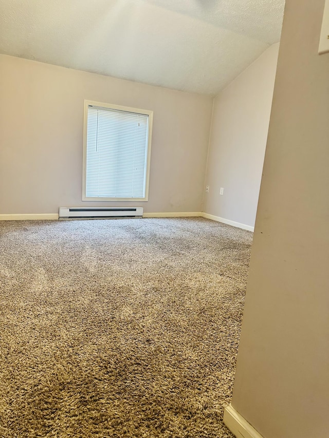 unfurnished room with carpet floors, baseboards, baseboard heating, and vaulted ceiling