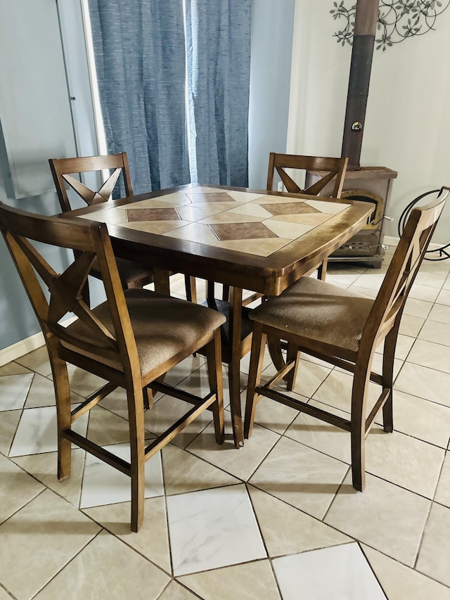 dining area with light tile patterned floors