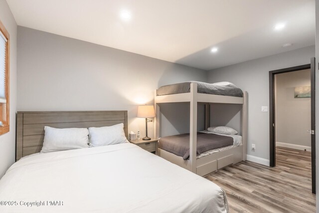 bedroom with wood-type flooring