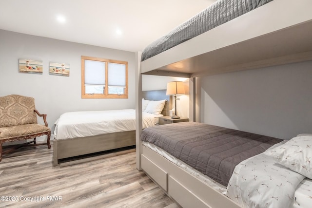 bedroom with light wood-style floors