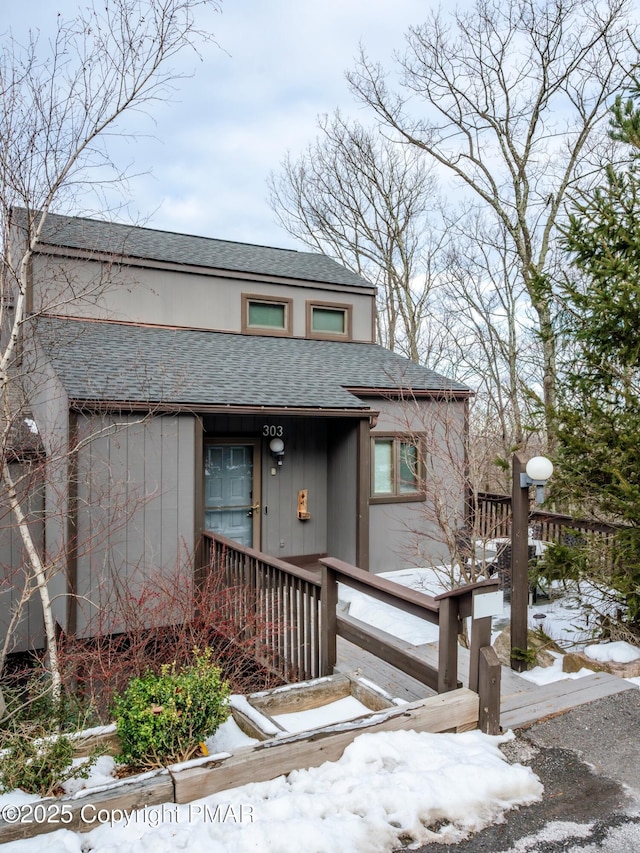 view of front of house featuring roof with shingles