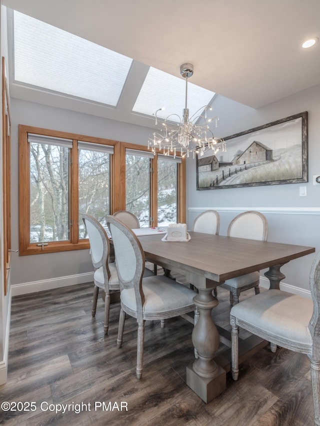 dining room with recessed lighting, baseboards, a notable chandelier, and wood finished floors